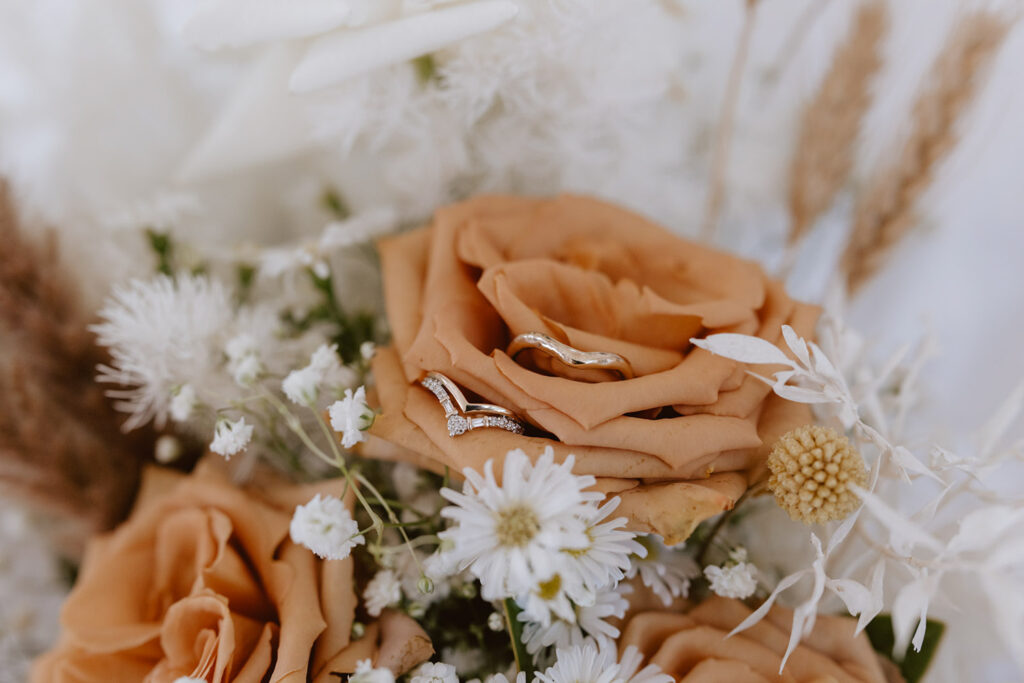 wedding rings in flowers